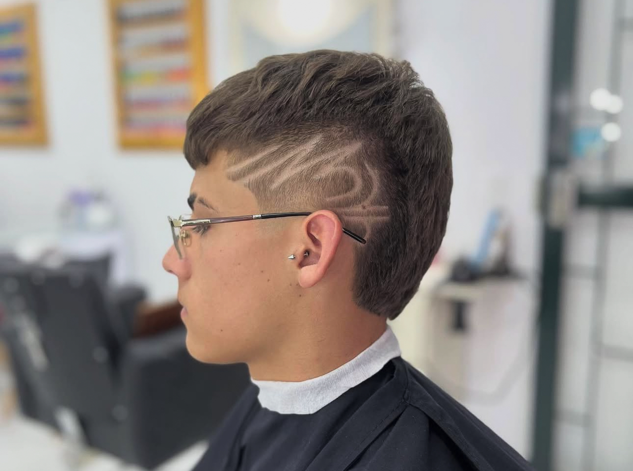 Corte de cabello en Aura